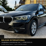 BMW X1 xDrive25e 2021 — original vehicle photograph 1 with Balkan International contact footer