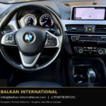 BMW X1 xDrive25e 2021 — original vehicle photograph 16 with Balkan International contact footer