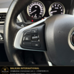 BMW X1 xDrive25e 2021 — original vehicle photograph 20 with Balkan International contact footer