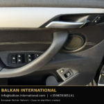 BMW X1 xDrive25e 2021 — original vehicle photograph 32 with Balkan International contact footer