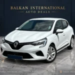 Renault Clio — digitally edited Balkan showroom and marble floor; illustrative backdrop