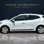 Renault Clio exterior view 3 — digitally edited Balkan International showroom backdrop and marble floor