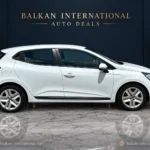 Renault Clio exterior view 6 — digitally edited Balkan International showroom backdrop and marble floor
